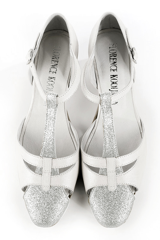 Light silver and pure white women's T-strap open side shoes. Round toe. Low comma heels. Top view - Florence KOOIJMAN